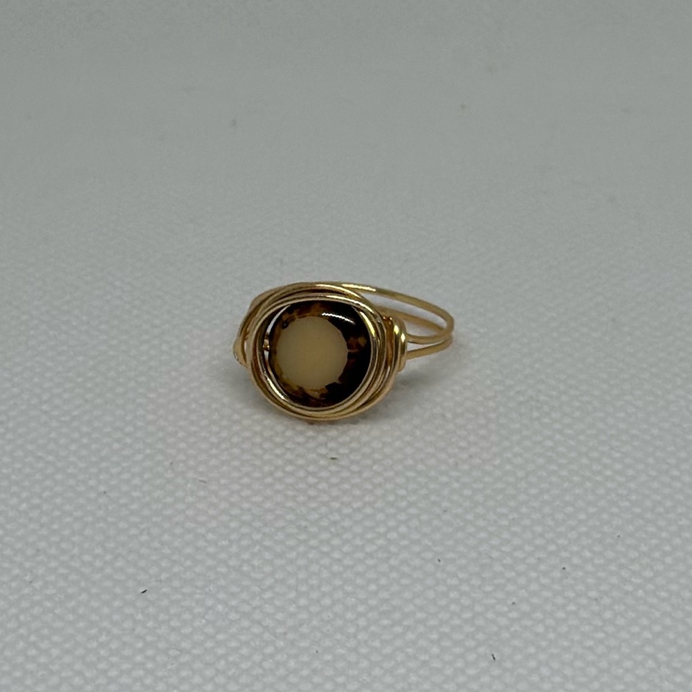 Handmade Gold Wire Wrapped Ring with a Brown and Cream Colored Bead